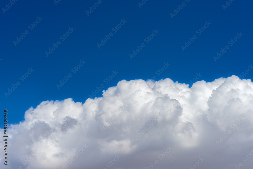 Puffy cumulonimbus cloud with a blue sky Puffy cumulonimbus cloud with a blue sky