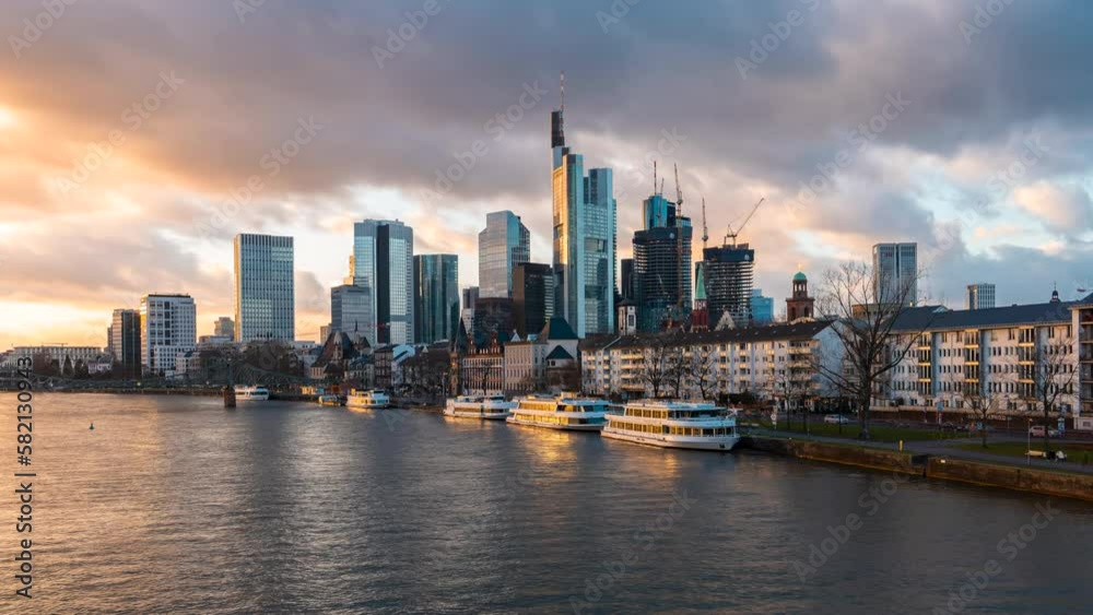 Frankfurt, Germany - January 30, 2023: Time lapse of the Frankfurt city skyline during golden hour. Frankfurt, Germany - January 30, 2023: Time lapse of the Frankfurt city skyline during golden hour.