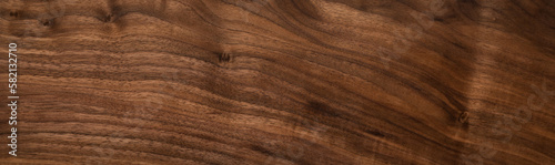Extra long black walnut wood plank texture background. Walnut natural texture background.  Wood texture background.	