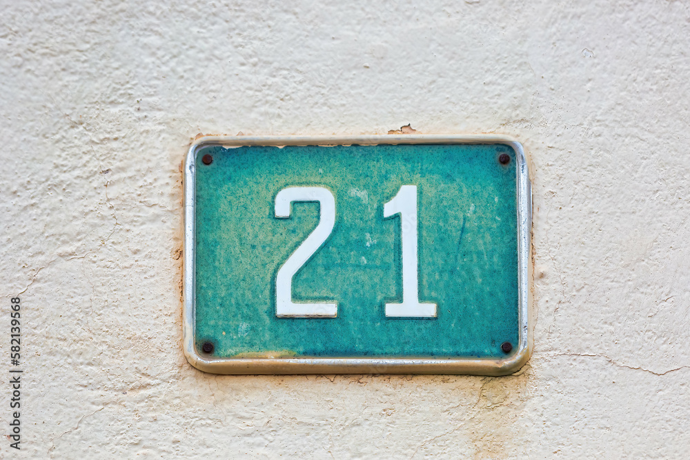 House Number 21 on White Wall: Address Marker for Home House Number 21 on White Wall: Address Marker for Home