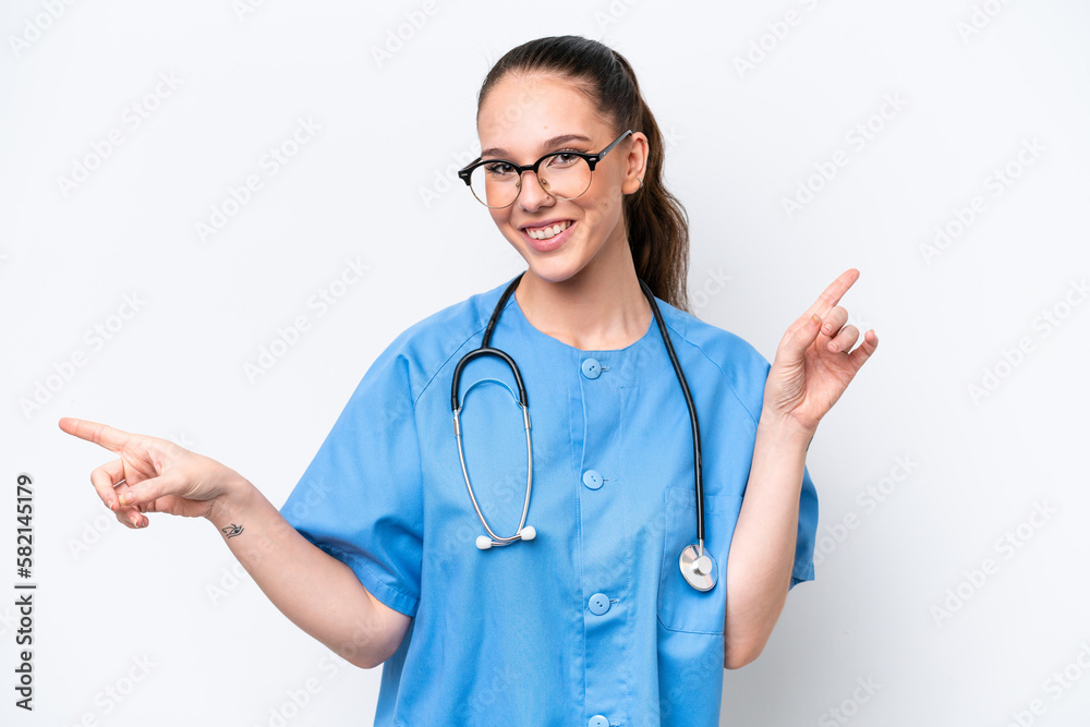 Young caucasian surgeon doctor woman isolated on white background pointing finger to the laterals and happy Young caucasian surgeon doctor woman isolated on white background pointing finger to the laterals and happy