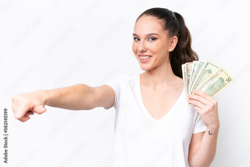 Young caucasian woman taking a lot of money isolated on white background giving a thumbs up gesture Young caucasian woman taking a lot of money isolated on white background giving a thumbs up gesture