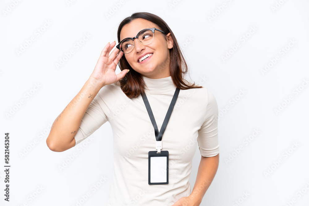 Young caucasian woman with ID card isolated on white background smiling a lot Young caucasian woman with ID card isolated on white background smiling a lot