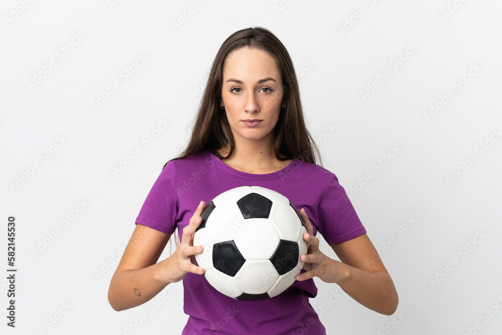 Young hispanic woman over isolated white background with soccer ball