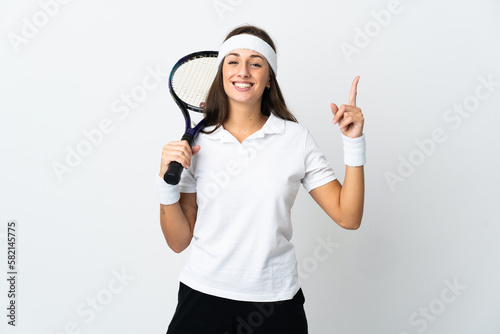 Young woman tennis player over isolated white background pointing up a great idea © luismolinero