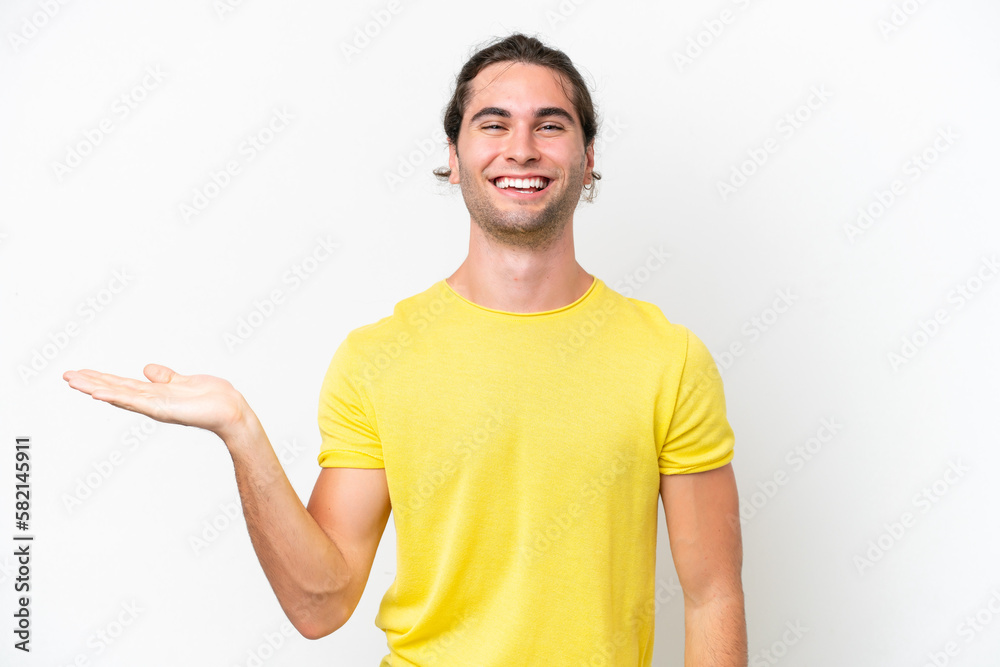 Caucasian handsome man isolated on white background holding copyspace imaginary on the palm to insert an ad Caucasian handsome man isolated on white background holding copyspace imaginary on the palm to insert an ad
