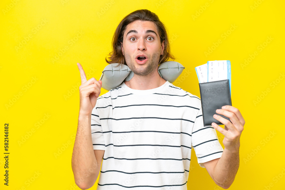 handsome Man with Inflatable Travel Pillow intending to realizes the solution while lifting a finger up