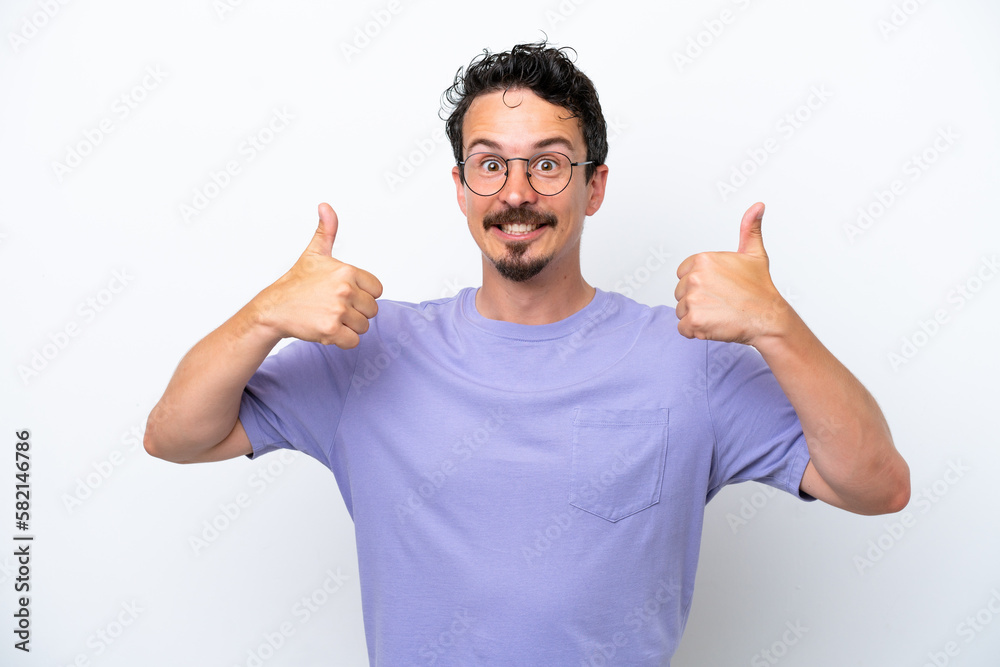 Young man with moustache isolated on white background giving a thumbs up gesture Young man with moustache isolated on white background giving a thumbs up gesture