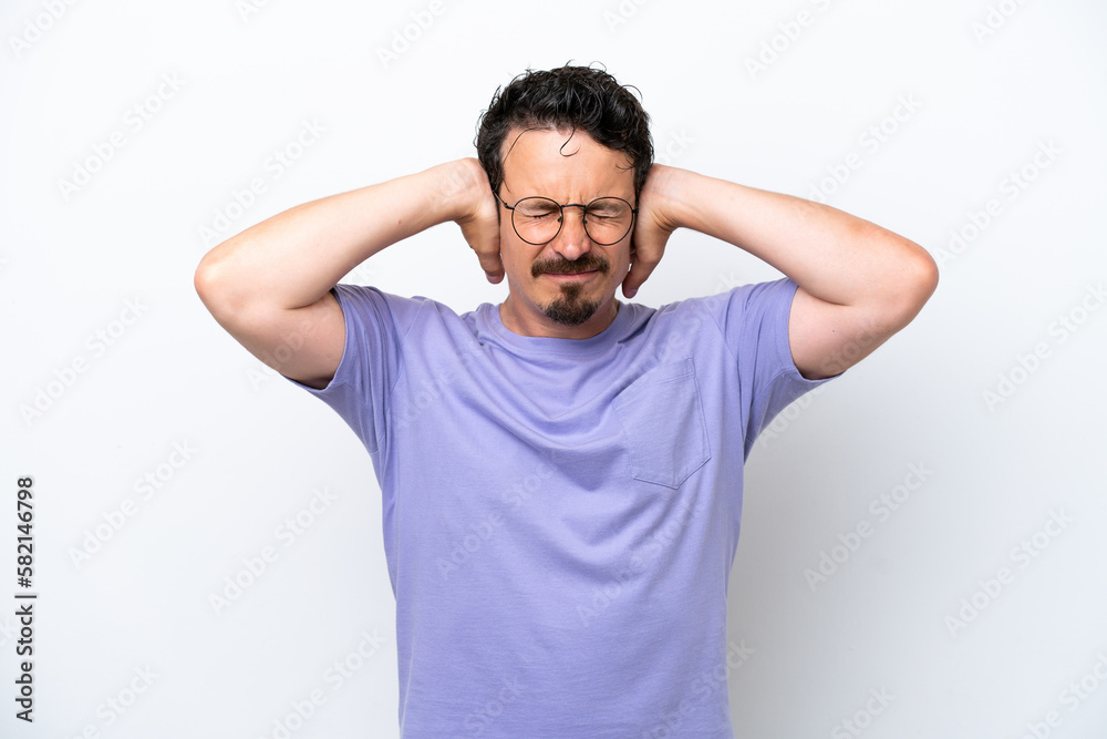 Young man with moustache isolated on white background frustrated and covering ears Young man with moustache isolated on white background frustrated and covering ears