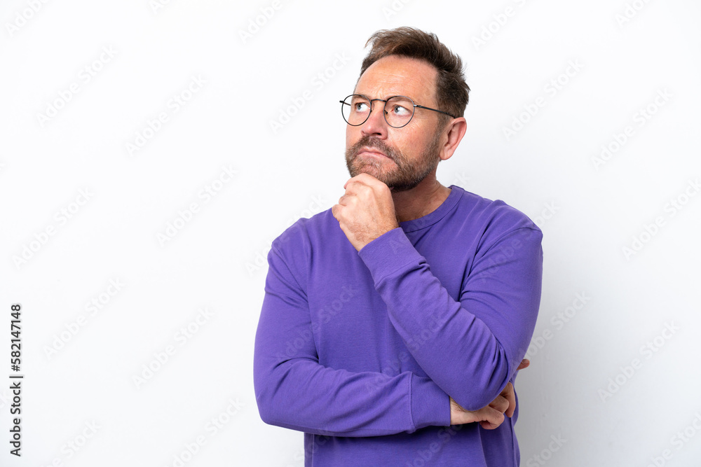 Middle age caucasian man isolated on white background and looking up Middle age caucasian man isolated on white background and looking up