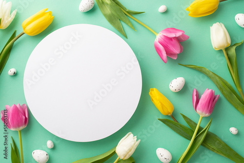 Easter decorations concept. Top view photo of white circle easter eggs and scattered pink yellow and white tulips on isolated teal background with copyspace