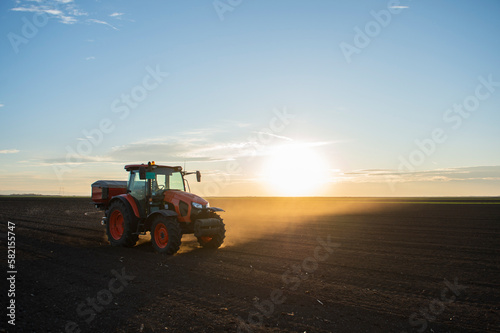 Tractor spreading artificial fertilizers © Vesna