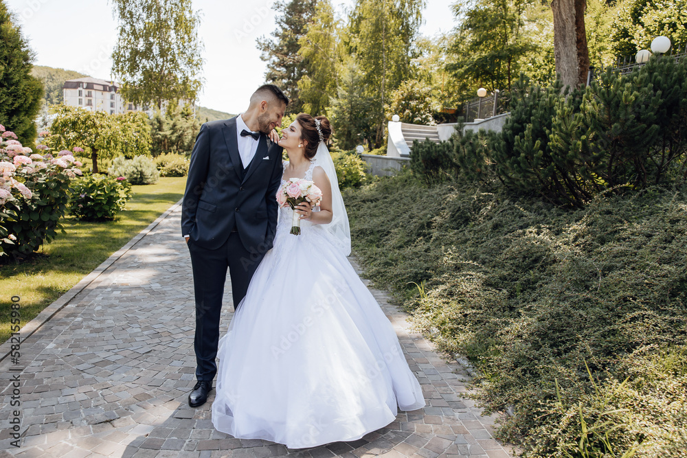 Happy bride and groom after wedding ceremony. Stylish groom. Adult groom. look at each other. Amazing wedding couple Happy bride and groom after wedding ceremony. Stylish groom. Adult groom. look at each other. Amazing wedding couple