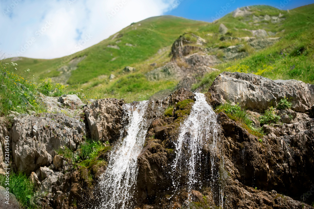 Beautiful waterfall on the mountain with blue sky Waterfall in tropical highlands.