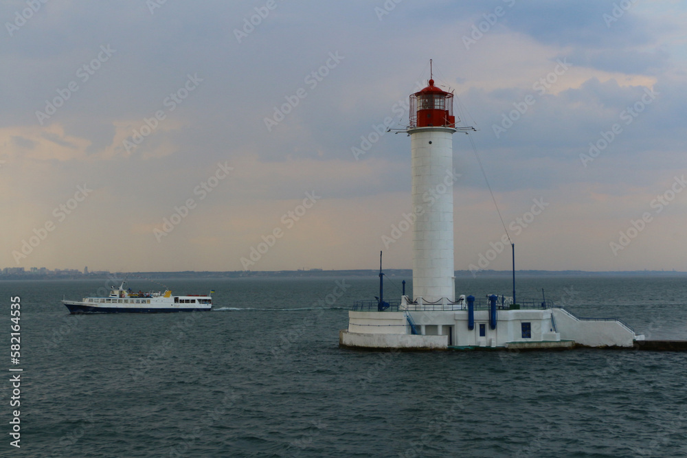 The lighthouse in the trade port of Odesa. Summer, 2018 The lighthouse in the trade port of Odesa. Summer, 2018