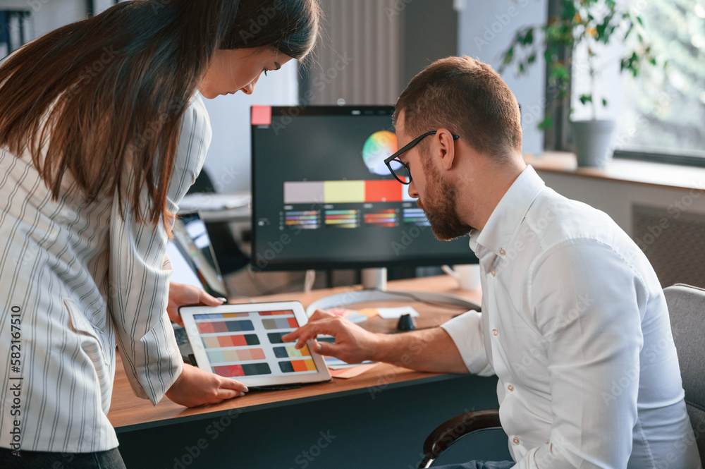 Obraz premium Creative job. Two designers are working together in the modern office