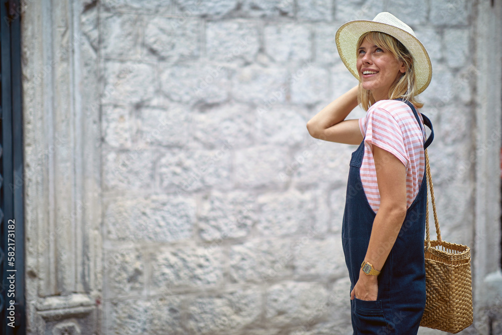 Portrait of a happy blonde sightseeing oldtown Portrait of a happy blonde sightseeing oldtown