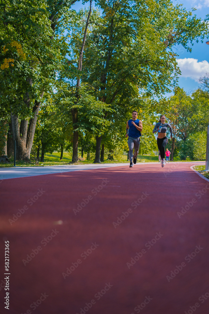 Fototapeta premium Young couple running