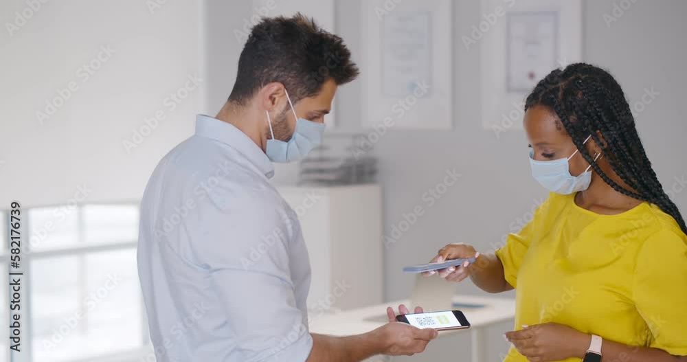 African-American female manager with smartphone scan vaccine qr-code of employee African-American female manager with smartphone scan vaccine qr-code of employee