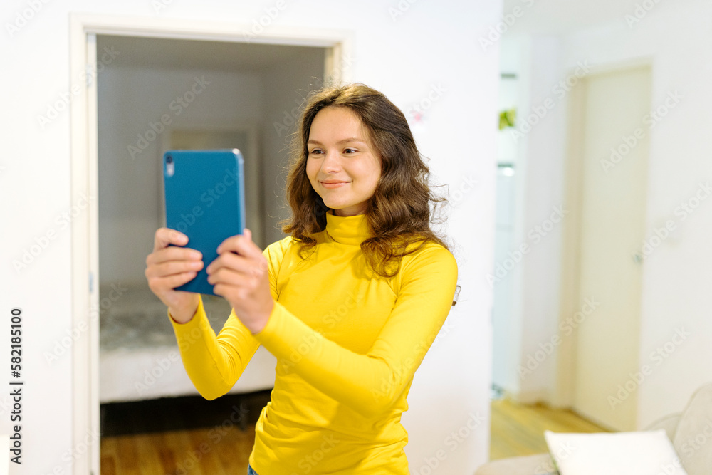 Content woman with tablet in modern apartment Content woman with tablet in modern apartment