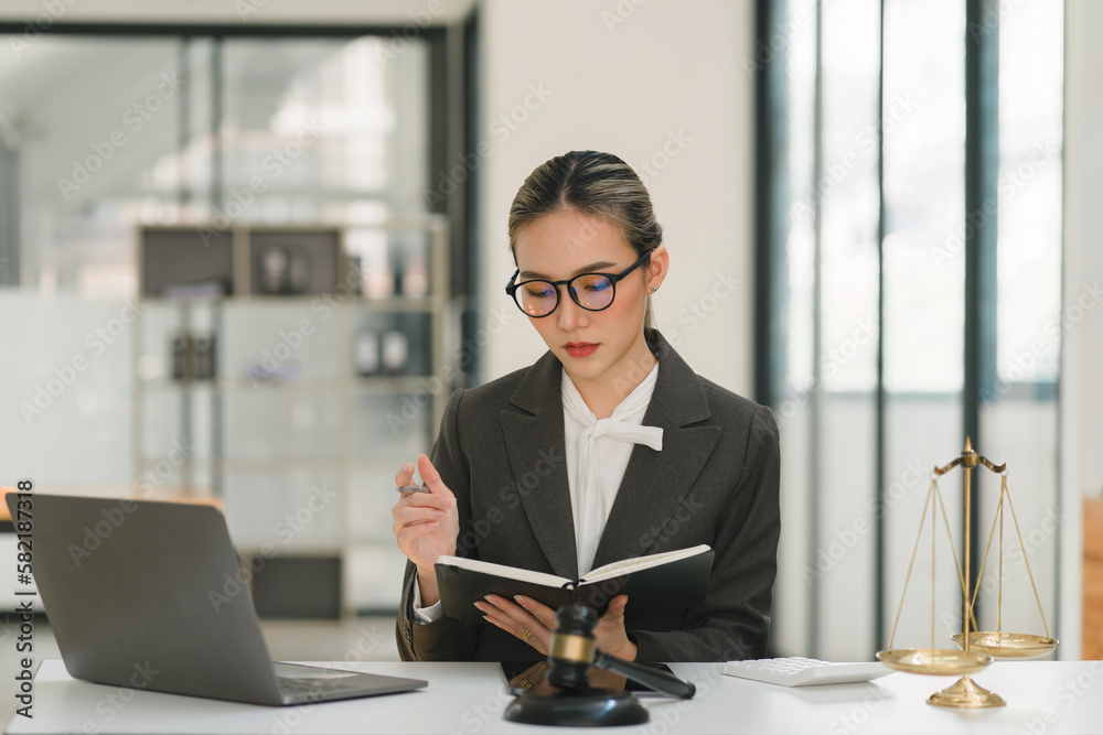 A businesswoman and lawyers are discussing contract papers with a brass scale on a desk in an office. The concepts of law, legal services, advice, justice, and real estate are being discussed. A businesswoman and lawyers are discussing contract papers with a brass scale on a desk in an office. The concepts of law, legal services, advice, justice, and real estate are being discussed.