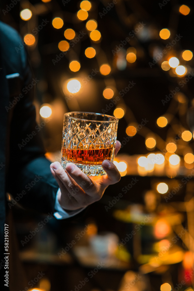 Businessman pouring whiskey victory drink