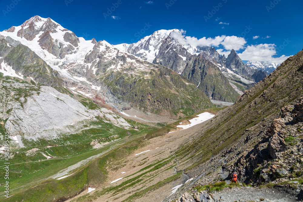 Summer trekking day in the mountains of Val Veny, Courmayeur