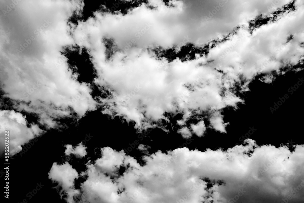White cloud on a black background. Dramatic clouds. Black and white atmospheric pattern