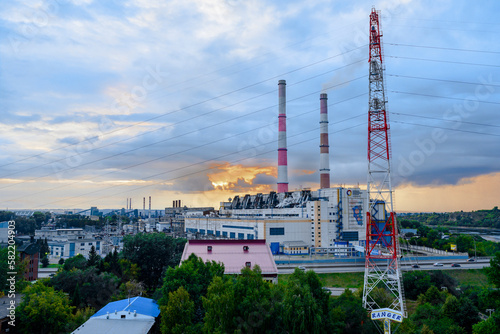 KEMEROVO, RUSSIA - AUGUST 19, 2022: Sunset over the thermal power plant of the Siberian Generating Company (as it is written on the building) in the city of Kemerovo