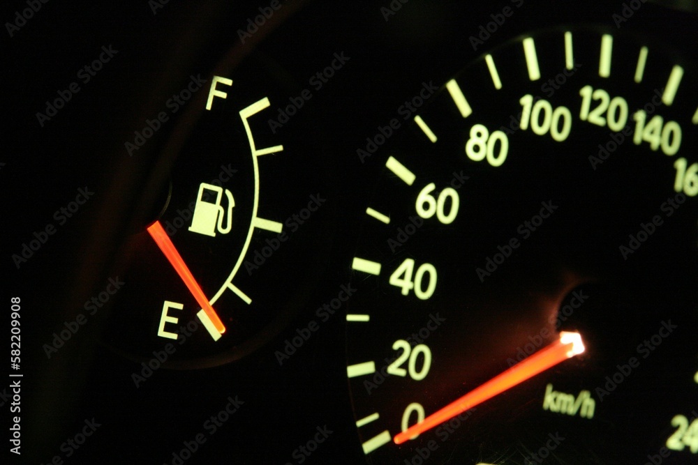 Closeup shot of a speedometer with a red arrow on 0. Out of gas concept. Closeup shot of a speedometer with a red arrow on 0. Out of gas concept.