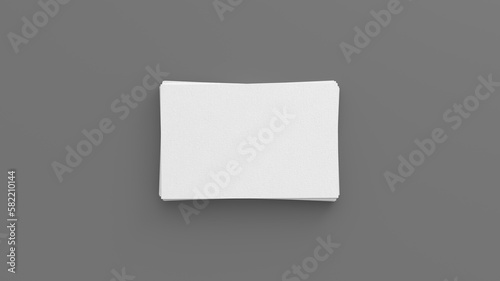 Business card mockup. Stack of business cards on gray background. View directly above © dimamoroz
