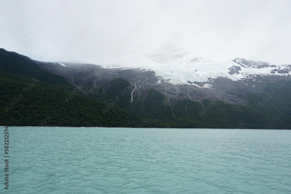 Landscape with clouds, lake, icebergs (Patagonia - Argentina)