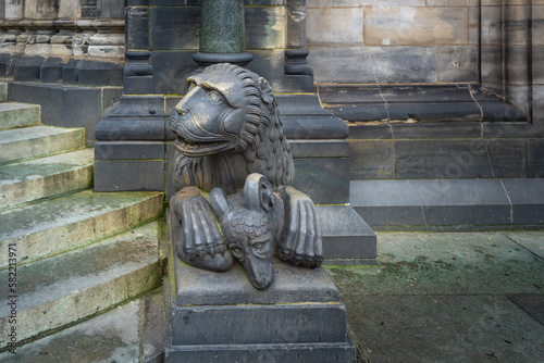 Lion with a goat sculpture in front of Bremen Cathedral - Bremen, Germany