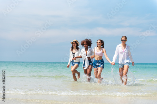 Group of teenage friends having fun on the beach summer, Lifestyles on weekend and vacation, Travel concept.