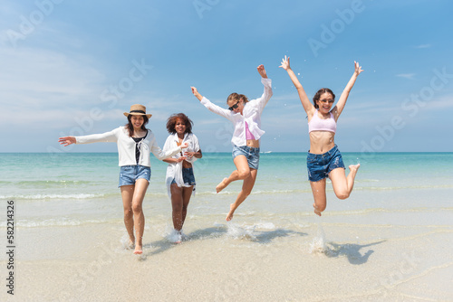 Group of teenage friends having fun on the beach summer, Lifestyles on weekend and vacation, Travel concept.