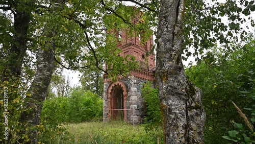 Abandoned red brick Russian church ruins, Estonia in the west.