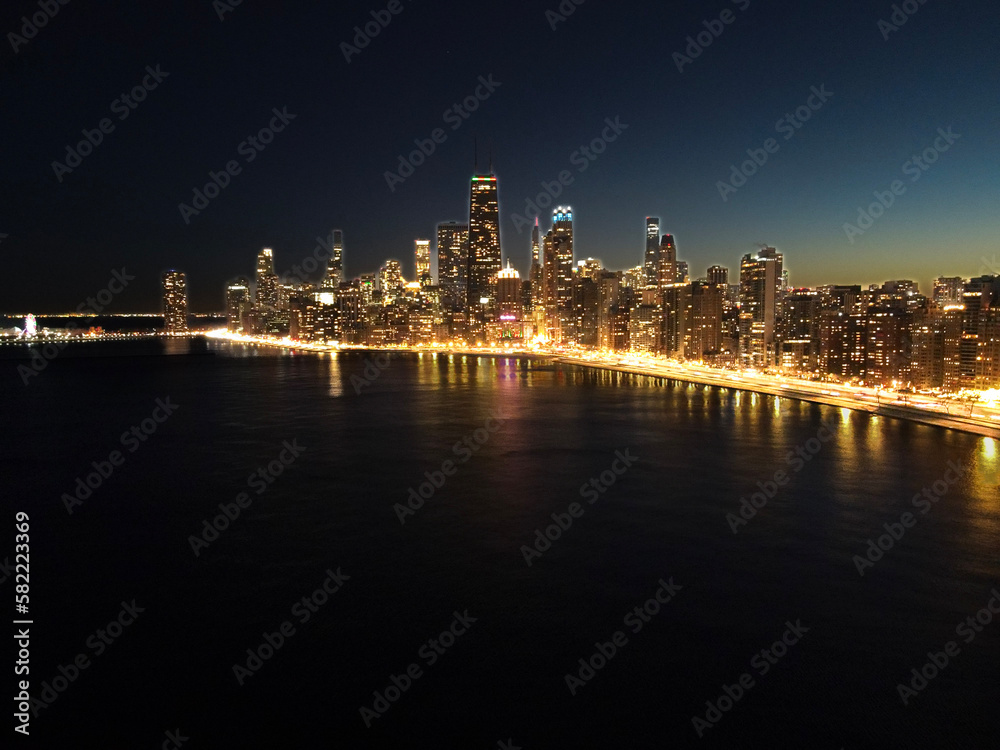 Aerial view of the downtown city of Chicago, Illinois, skyline at night. USA 2023