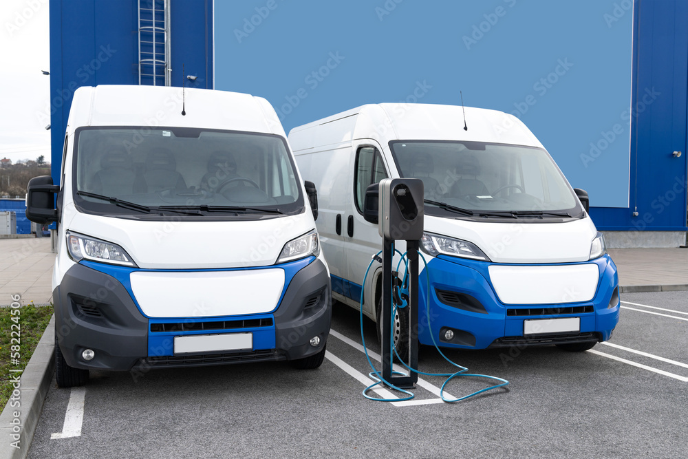 Electric delivery vans with electric vehicles charging station.	