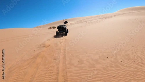 Canam UTV Side by Side driving in the Sand Dunes photo