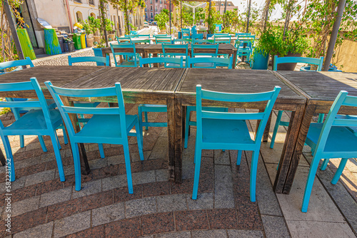 Tables and chairs in a restaurant © murasal