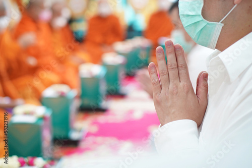 Man's hands clasped on his chest  Paying homage to Buddhist monks
