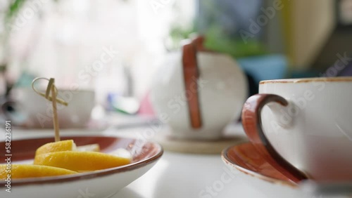 Wallpaper Mural Laid Morning Table for Breakfast in a Cafe. Teapot, Mugs and a Plate with Lemon Slices. No People. Slow Motion. Torontodigital.ca