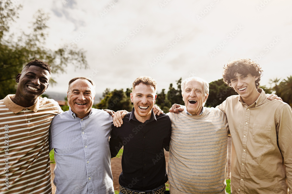 © Alessandro Biascioli - Happy multigenerational group of men with different ethnicities having fun smiling in front of camera at park - People diversity concept © Alessandro Biascioli - Happy multigenerational group of men with different ethnicities having fun smiling in front of camera at park - People diversity concept