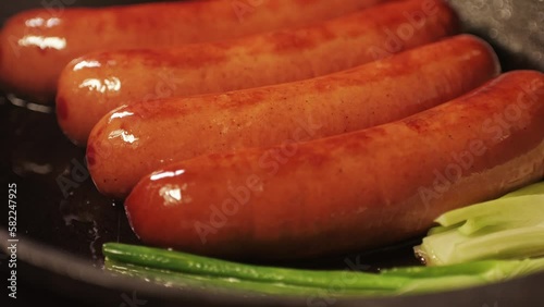 Chef grill smoked german sasuages tclose up, frankfurt, bratwursts and fresh Traditional German Cuisine. Composition of Cooked National Czech Food.  photo