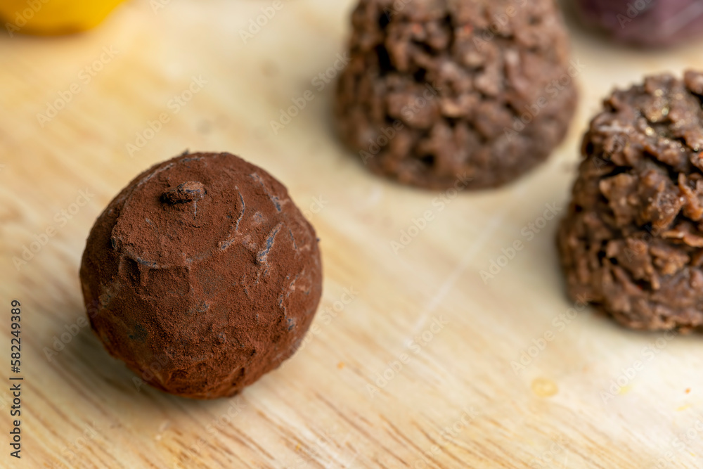 Chocolate sweet candy in the shape of a ball on the table