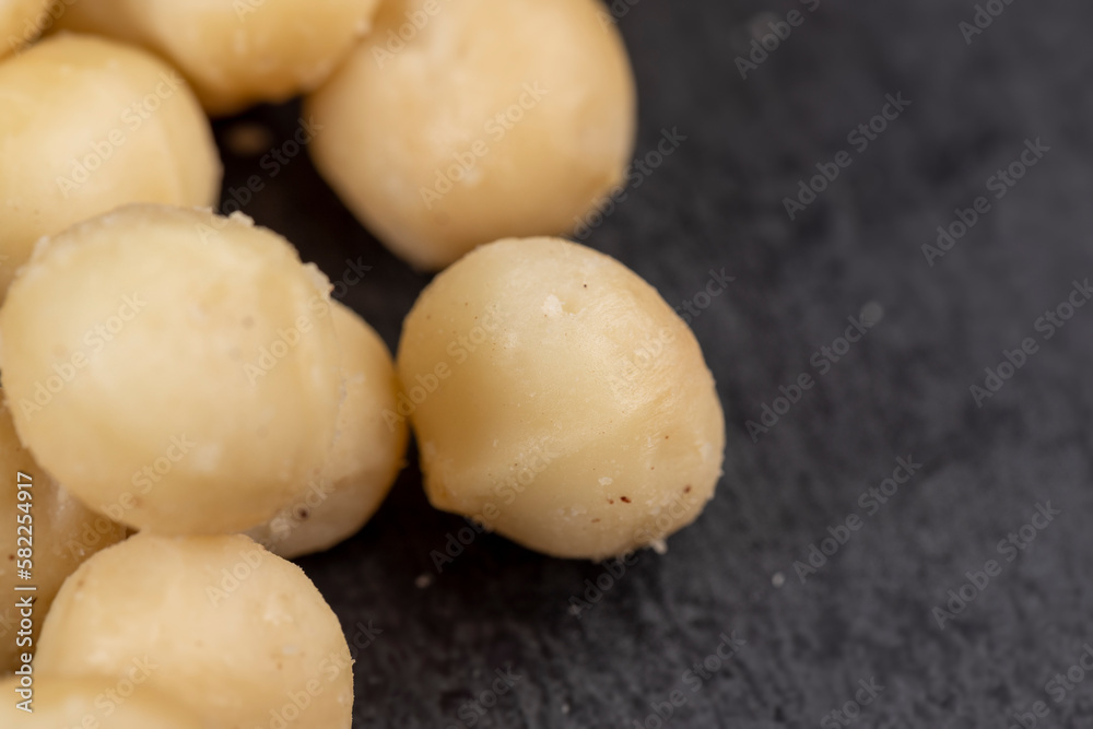 Peeled macadamia nuts on the table Peeled macadamia nuts on the table