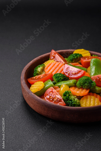 Salad of fresh and steamed vegetables cherry tomatoes, broccoli and carrots