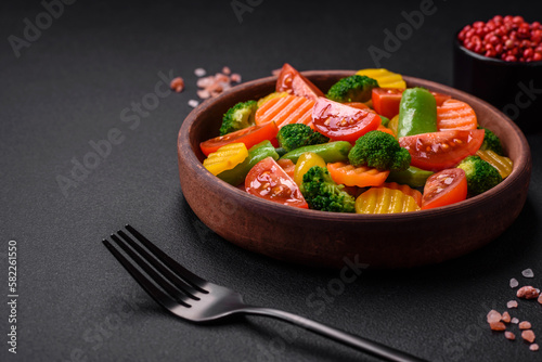 Salad of fresh and steamed vegetables cherry tomatoes, broccoli and carrots