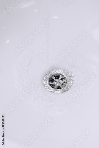 Water flows in white sink