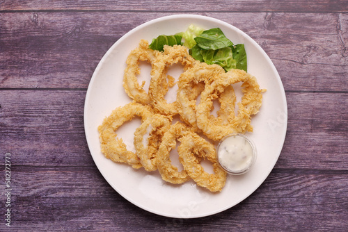 cooked squid rings and shrimp on a plate top view 